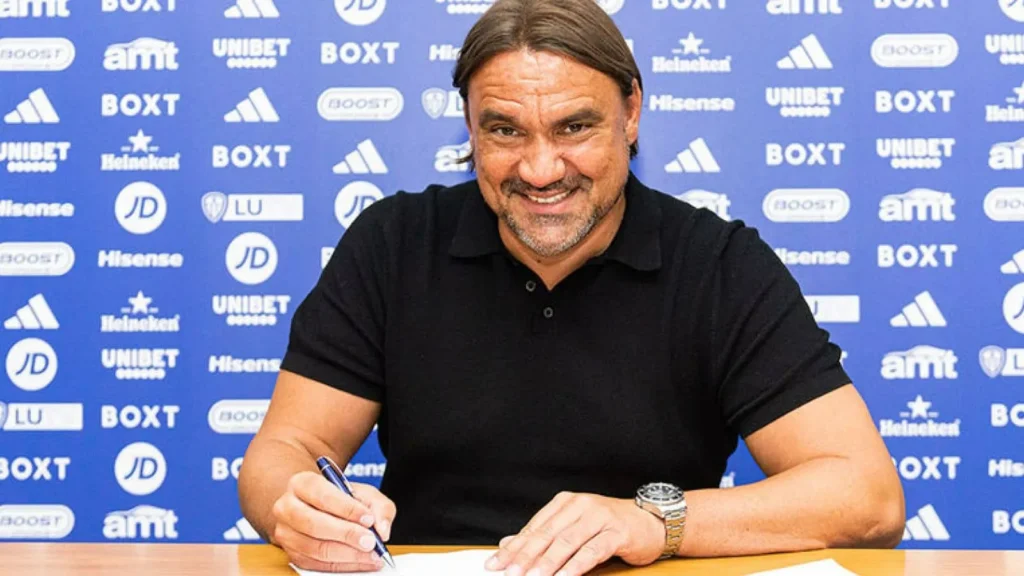 Leeds United Manager Daniel Frake signing the contract. He is expected to lead the side back to the Premier League