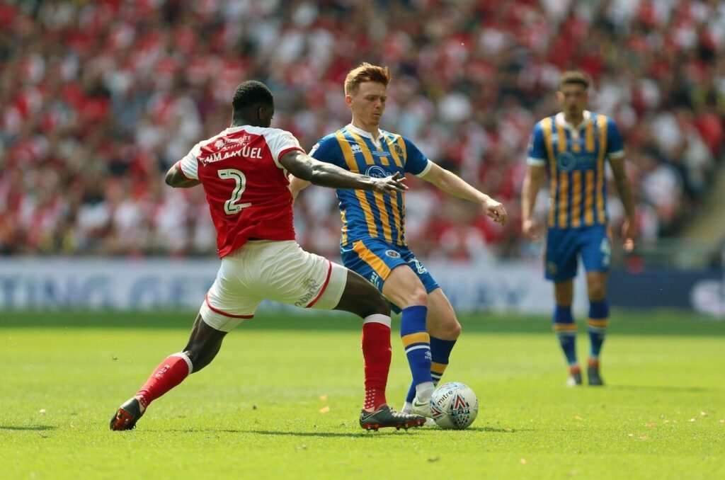 Shrewsbury FC and Rotherham players in action